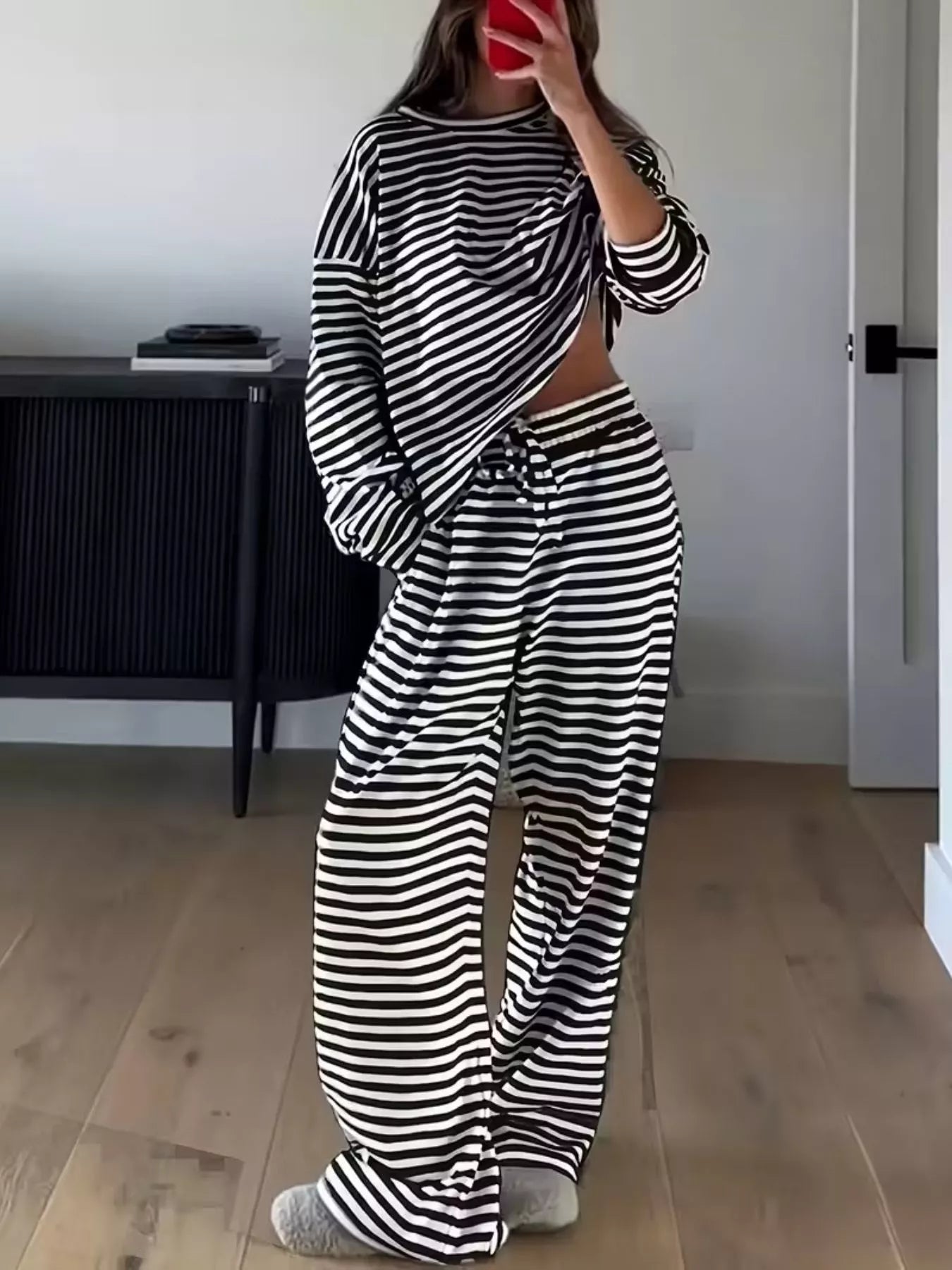 Black-and-white striped crop-waist long-sleeve top with matching wide-leg pants set